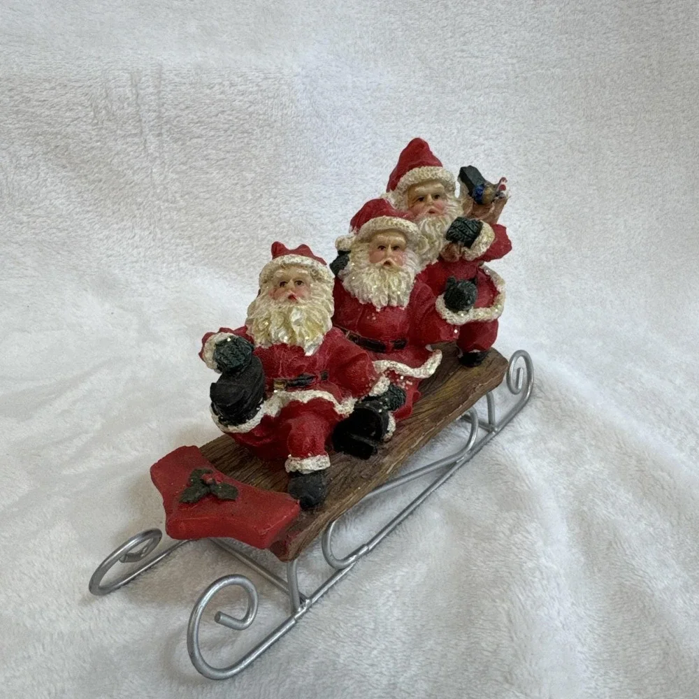 Three Jolly Santas Riding On a Sled‎ Christmas Figurine Vintage 90s